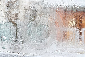 Frosty pattern on glass winter window, look through glass