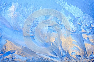 Frosty Pattern on the window in winter. Winter background. Aggregate state of water. Patterned background