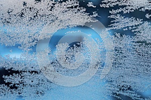 Frosty patterns on a frozen window, background