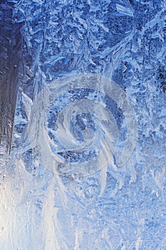 frosty patterns on frozen window glass