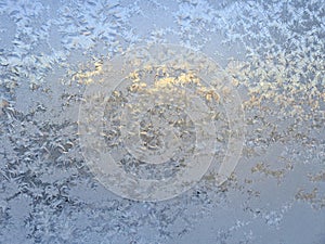 Frosty patterns on the window. Nature draws. At night there was a severe frost, the window was covered with patterns.