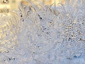 Frosty patterns on the window. Nature draws. At night there was a severe frost, the window was covered with patterns. Christmas