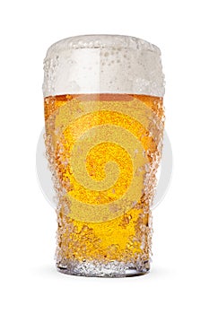 Frosty pint glass of fresh cold beer with ice crystals isolated on white background