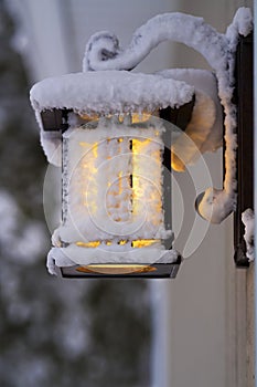 Frosty Porch Lantern after Fierce Winter Storm