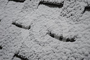 Frosty Snow on shingles of a roof