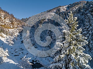 A frosty and sunny day is in mountains, view from above