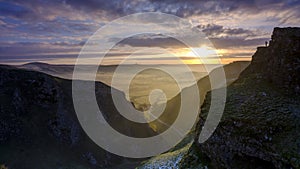 Frosty sunrise over Winnats Pass in the Peak District National Park, UK