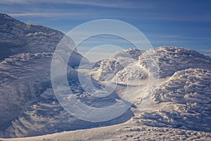 Frosty sunrise on Vitosha Mountain, Sofia, Bulgaria - beautiful winter landscape - first rays of sunlight over the fresh snow dust