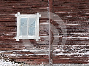 Frosty window of old log home