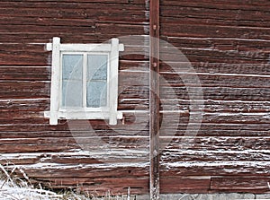 Frosty window of old log home photo