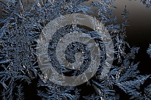 Frosty winter background photo of ice buildup on a window.