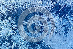 Frosty winter pattern at a window glass