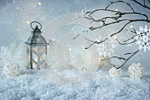 Frosty winter wonderland with snowfall and magic lights. Christmas greeting card. Copy space