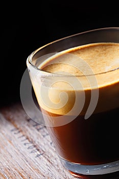 Frothy aromatic mug of fresh coffee photo