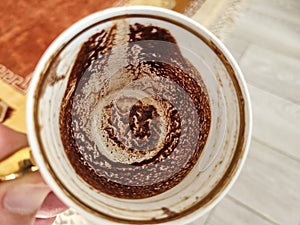 Frothy Turkish coffee in a ceramic cup