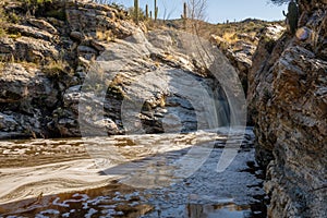 Frothy Waterfall Dumps Silty Water In The Desert