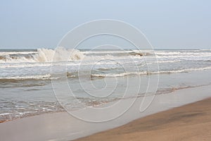 Frothy waves on beach