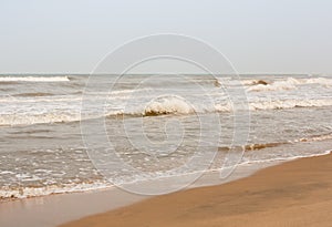 Frothy waves on beach