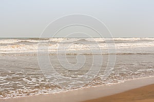 Frothy waves on beach