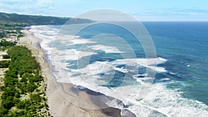 Frothy waves at Nusa Dua beach photo