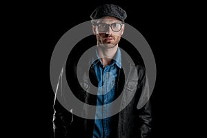 Frown man with cap, glasses and leather jacket