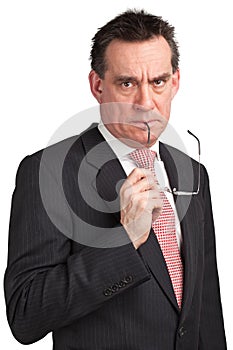 Frowning Business Man in Suit Holding Glasses