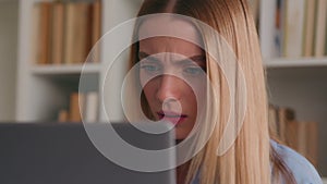 Frowning confused puzzled shocked Caucasian woman looking negative shock to laptop bad result failure business problem