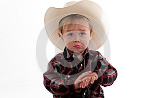 Frowning little cowboy