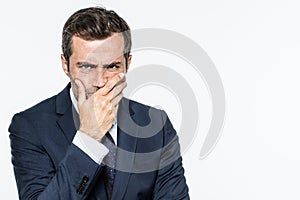 Frowning unhappy businessman thinking, expressing corporate doubts and concerns photo