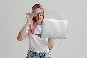 Frowning upset young blonde white woman in glasses