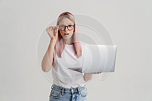 Frowning upset young blonde white woman in glasses