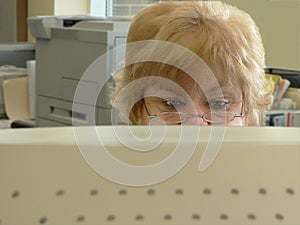 Frowning woman looking at computer