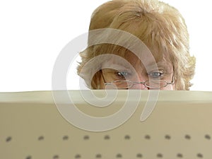 Frowning woman looking at computer