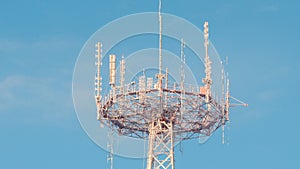 Frozed telecommunication tower on blue sky background