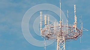 Frozed telecommunication tower on blue sky background