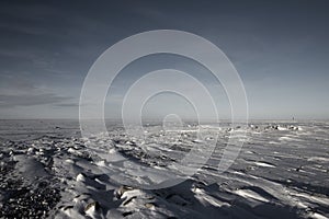 Frozen arctic landscape with snow on the ground