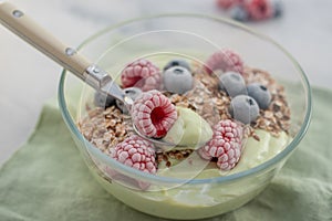 Frozen avocado smoothie bowl with frozen berries