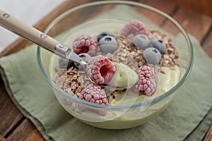 Frozen avocado smoothie bowl with frozen berries