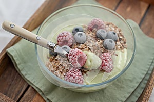 Frozen avocado smoothie bowl with frozen berries