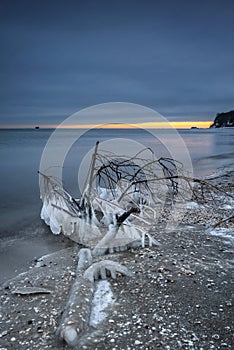 Frozen Baltic Sea beach in Babie DoÅ‚y at sunset, Gdynia. Poland