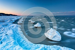 Frozen beach of the Baltic Sea in Babie DoÅ‚y at sunset, Gdynia. Poland