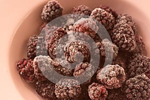 Frozen blackberries on plate