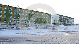 Frozen block of flats in Siberia. Tiksi .Painted blocks of Russia. Abandoned building in Tiksi