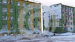 Frozen block of flats in Siberia. Tiksi .Painted blocks of Russia. Abandoned building in Tiksi