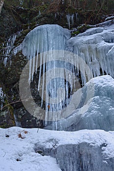 Frozen blue waterfall in the mountains, Slovakia