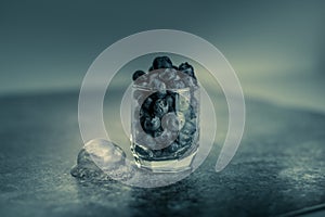 Frozen blueberries in a glass