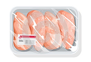Frozen boneless chicken breasts, poultry fillet on plastic tray wrapped up transparent kitchen film.