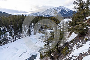 Frozen Bow River in winte. Beautiful scenery in Banff National Park, Alberta, Canada.