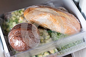 Frozen bread in the home freezer. Long life food storage concept