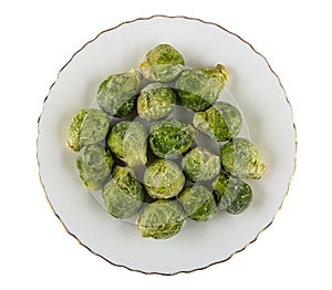 Frozen broccoli in plate isolated on white. Top view